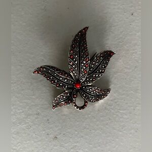 Vintage German intricate brooch maple leaf-shaped with small red crystals